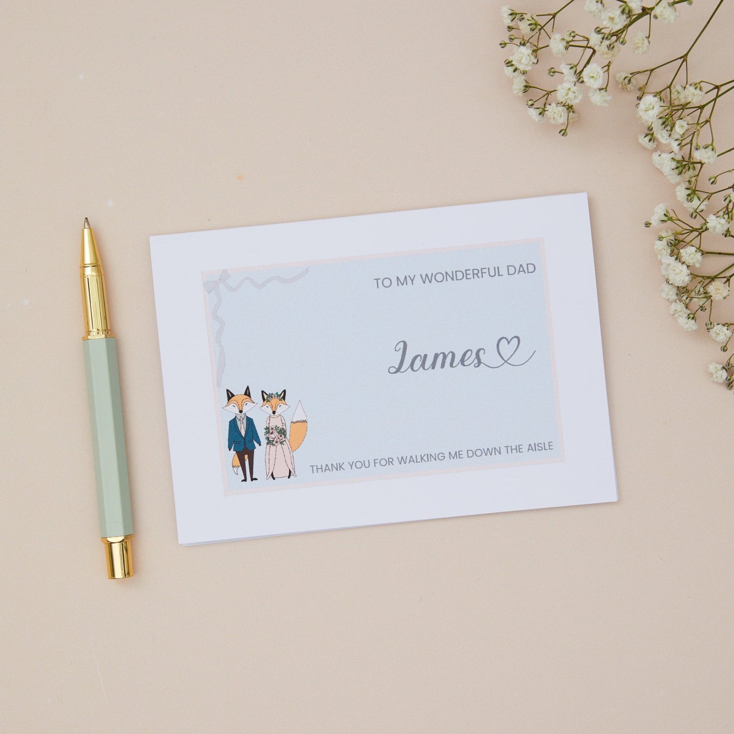 Dad Thanks for walking me down the Aisle Card. A Fox couple in bridal attire with the label 'To my wonderful Dad, thank you for walking me down the aisle. The Card is set against a pale beige background with stationery items, and dried flowers.