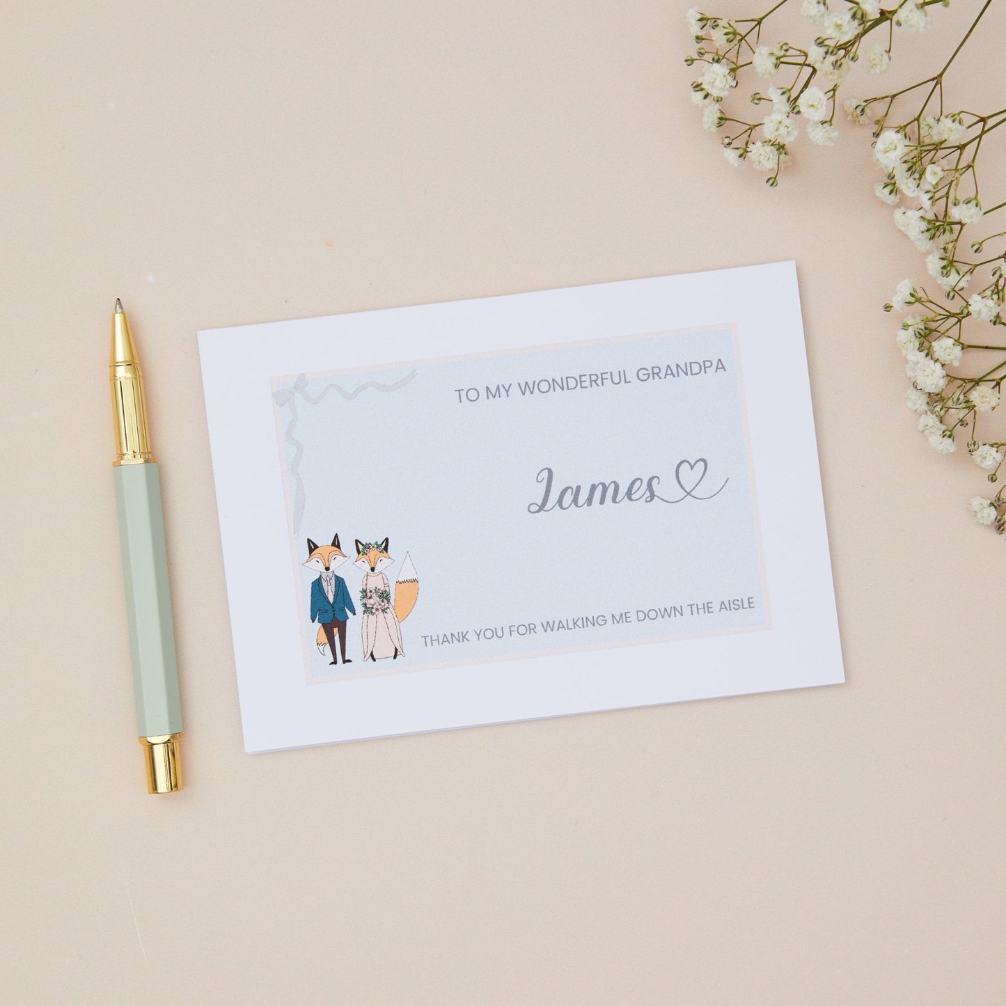 Grandfather Thanks for walking me down the Aisle Card. A Fox Couple in their bridal attire with the label 'To my wonderful grandfather thank you for walking me down the aisle. The Card is set against a pale beige background with stationery items.