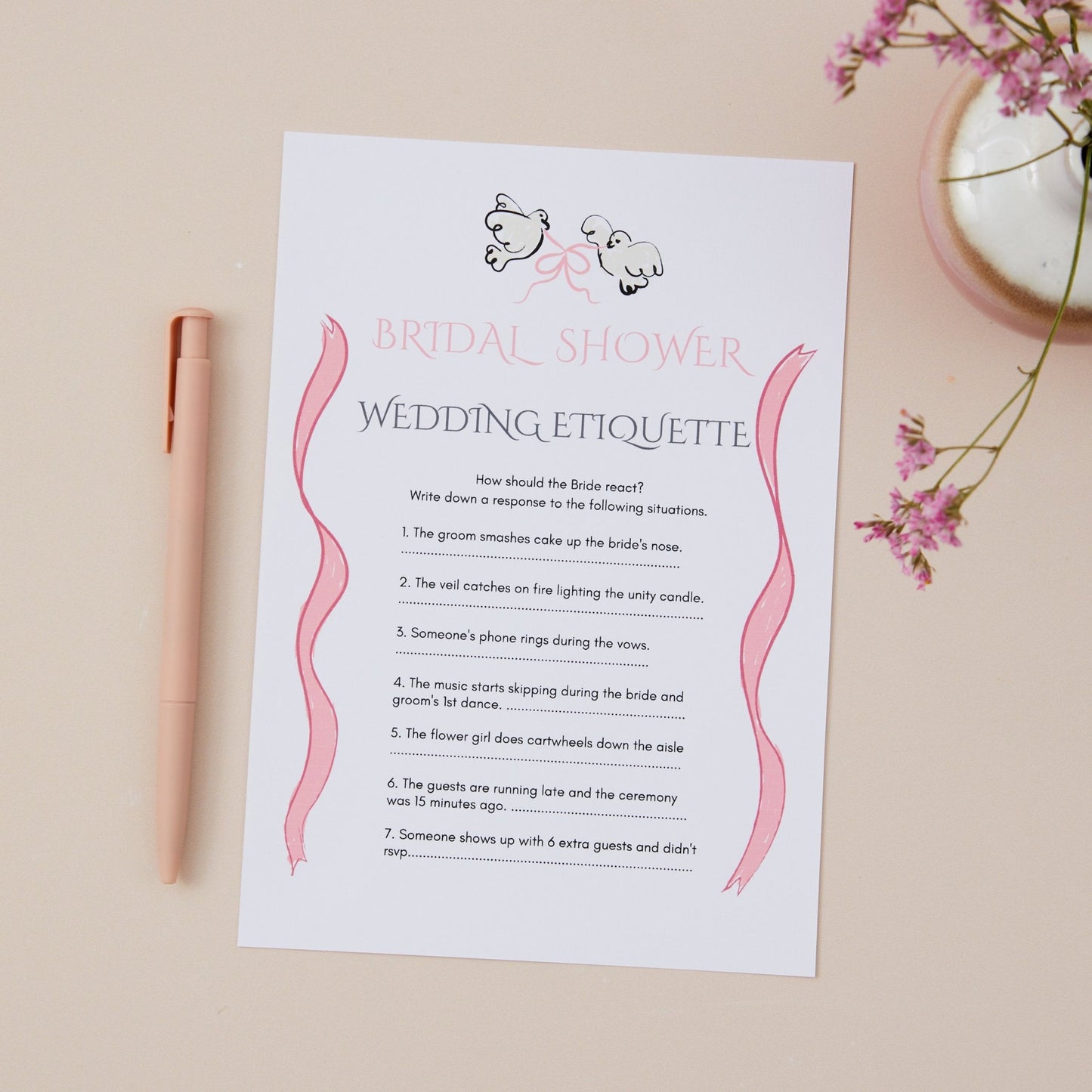 A bridal shower game titled 'Bridal Shower Wedding Etiquette' with written questions and options that guests can choose about the right etiquette. The Game card is part of a design collection that features a pair of doves, linked with a pink bow. The Game Card is placed on a neutral background with a pen and decorative items in the background.