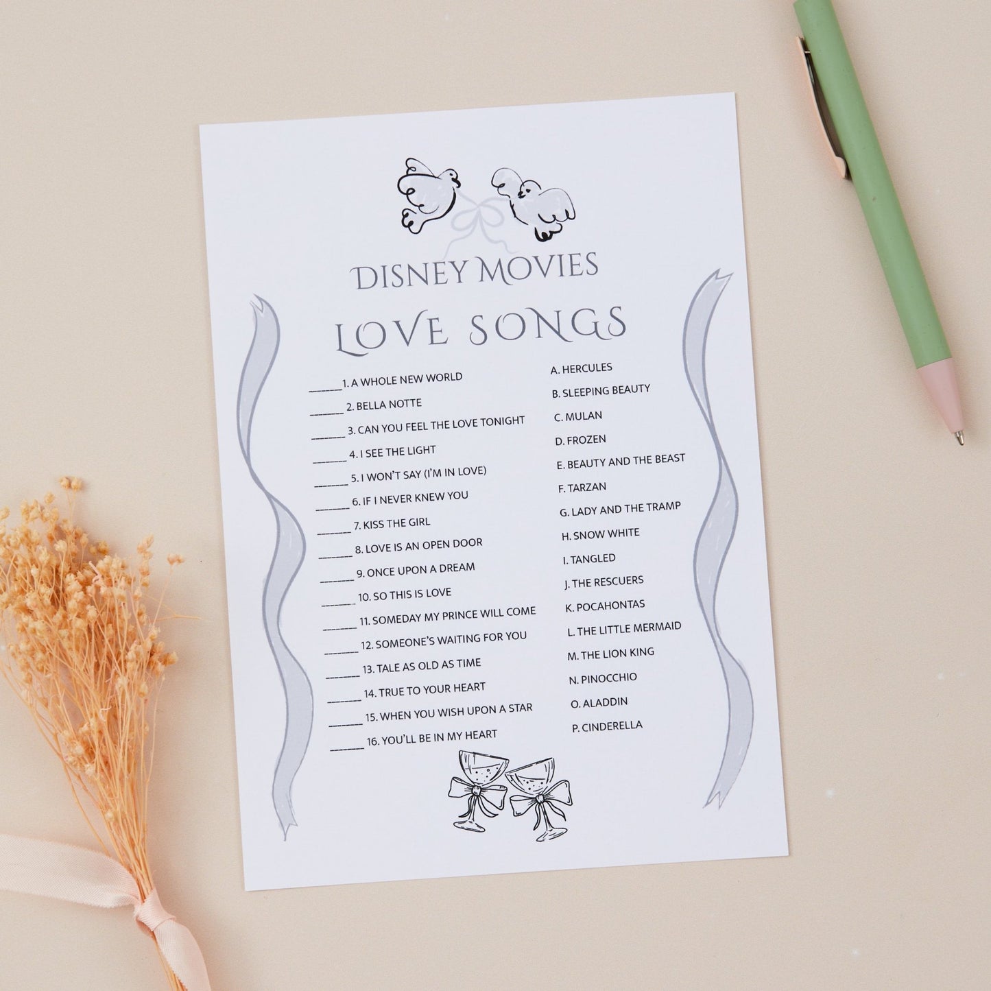 Wedding Reception Disney Movies guessing game cards which are love songs themed. The Game card is placed against a neutral background with dried flowers and stationery items.