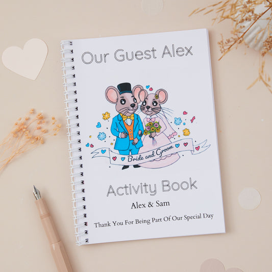 A5-sized wedding activity book with a 'Mr & Mrs Mouse' design, featuring illustrations of a mouse couple in formal attire, suitable for personalisation with the name of the child guest, couple getting  married and their wedding date.