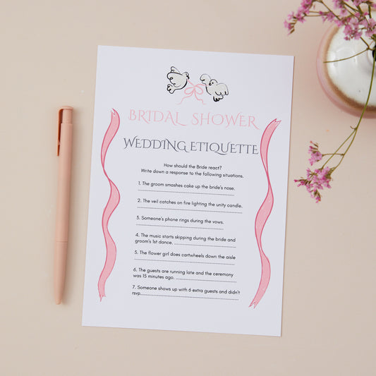 A bridal shower game titled 'Bridal Shower Wedding Etiquette' with written questions and options that guests can choose about the right etiquette. The Game card is part of a design collection that features a pair of doves, linked with a pink bow. The Game Card is placed on a neutral background with a pen and decorative items in the background.