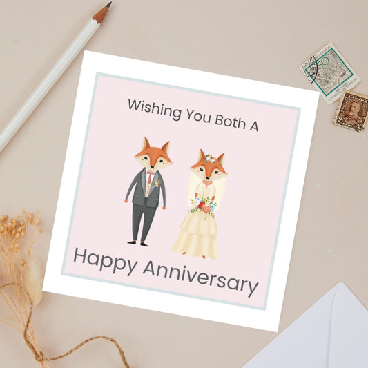 Wedding Anniversary card with a Bridal fox couple, Mr Fox dress in dark grey suit and Mrs Fox dressed as a Bride. Illustration on a beige background